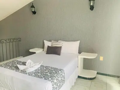 Cama o camas de una habitación en Hotel & Suites Bausan