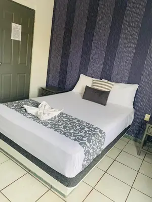 Cama o camas de una habitación en Hotel & Suites Bausan
