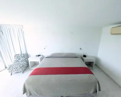 Cama o camas de una habitación en We Hotel Acapulco