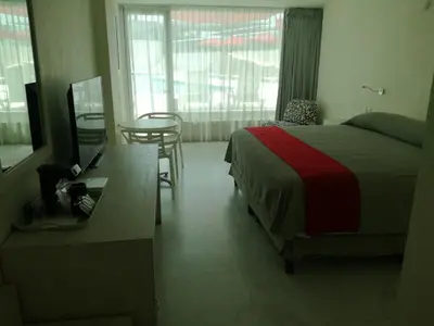 Cama o camas de una habitación en We Hotel Acapulco