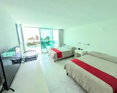 Cama o camas de una habitación en We Hotel Acapulco