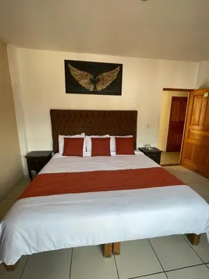 Cama o camas de una habitación en Hotel & Balneario Los Angeles