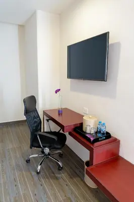 Una televisión o centro de entretenimiento en Mision Puebla Angelopolis