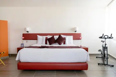 Cama o camas de una habitación en Mision Puebla Angelopolis