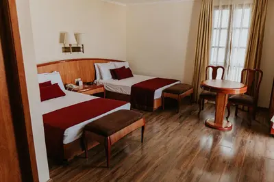 Cama o camas de una habitación en Gran Hotel Diligencias