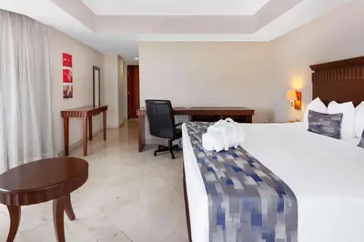Cama o camas de una habitación en Ramada Plaza by Wyndham Veracruz Boca del Rio