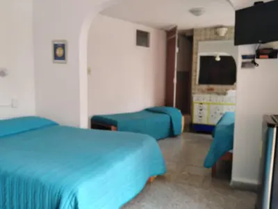 Una televisión o centro de entretenimiento en Gal - Habitaciones Confortables