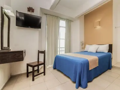 Cama o camas de una habitación en Hotel Trianon