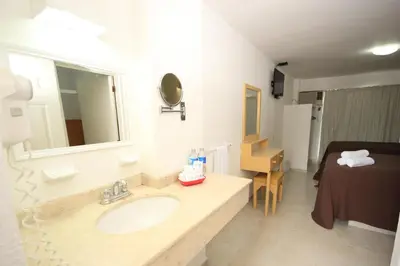 Cama o camas de una habitación en Hotel Posada del Carmen