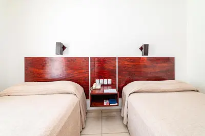 Cama o camas de una habitación en Hotel Castillo Huatulco & Beach Club