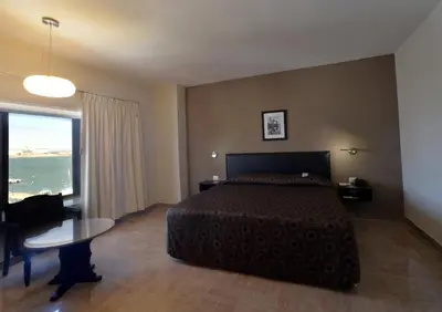 Cama o camas de una habitación en Hotel Mar y Tierra