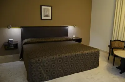 Cama o camas de una habitación en Hotel Mar y Tierra