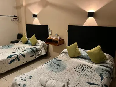 Cama o camas de una habitación en Hotel Las Brisas
