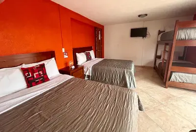 Cama o camas de una habitación en Hotel MH