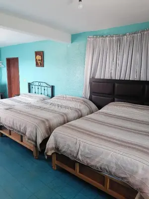 Cama o camas de una habitación en Hospedaje La Cienega