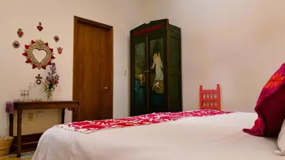 Cama o camas de una habitación en El Diablo y la Sandia B&B