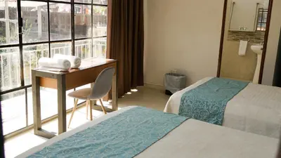 Cama o camas de una habitación en Acapulco Amor