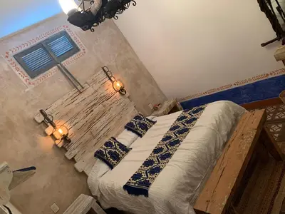 Cama o camas de una habitación en La Casona Azul Boutique Hotel