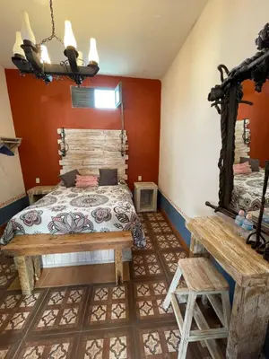 Cama o camas de una habitación en La Casona Azul Boutique Hotel