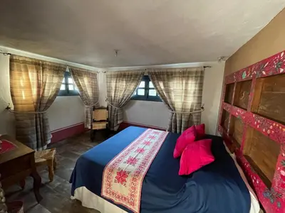 Cama o camas de una habitación en La Casona Azul Boutique Hotel