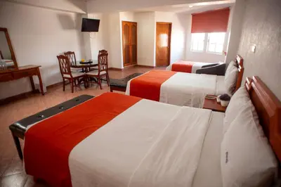 Cama o camas de una habitación en Hotel Atenas