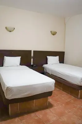 Cama o camas de una habitación en OYO Hotel Plaza Veracruz Centro Historico