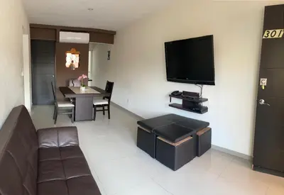 Una televisión o centro de entretenimiento en Departamento Acapulco Diamante