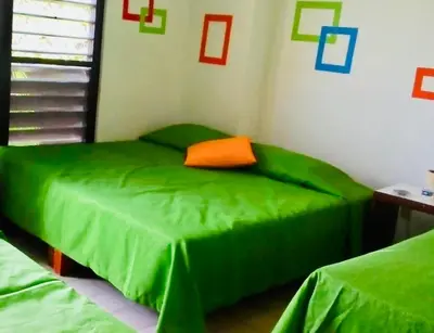 Cama o camas de una habitación en Hotel El Kiosco