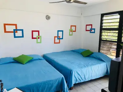 Cama o camas de una habitación en Hotel El Kiosco