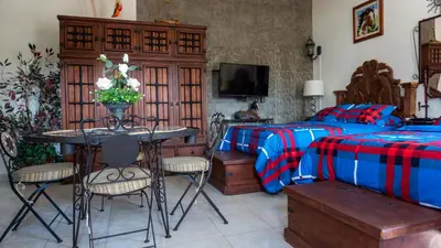 Cama o camas de una habitación en El Jardín del Edén B&B Boutique