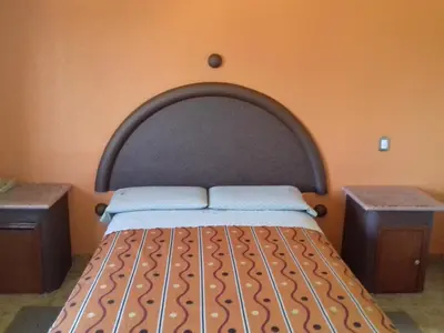 Cama o camas de una habitación en Promotora Hotelera Tocuila