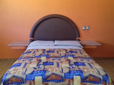 Cama o camas de una habitación en Promotora Hotelera Tocuila