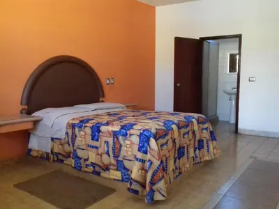 Cama o camas de una habitación en Promotora Hotelera Tocuila