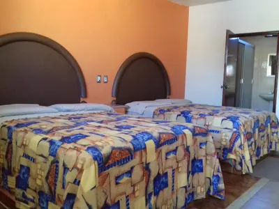 Cama o camas de una habitación en Promotora Hotelera Tocuila