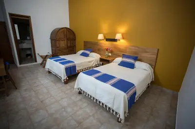 Cama o camas de una habitación en Parador San Agustin
