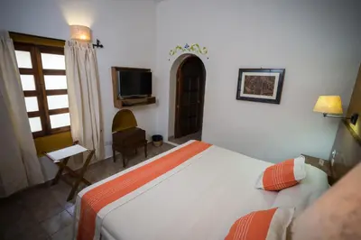 Cama o camas de una habitación en Parador San Agustin