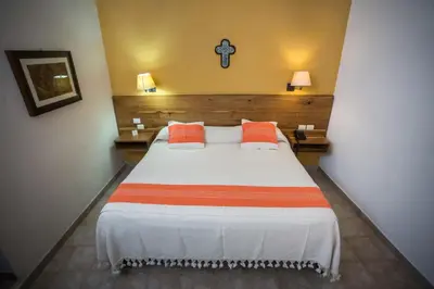 Cama o camas de una habitación en Parador San Agustin