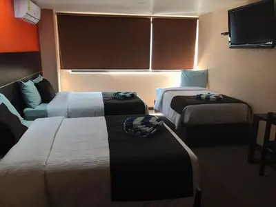 Cama o camas de una habitación en Oaxaca Inn Reforma