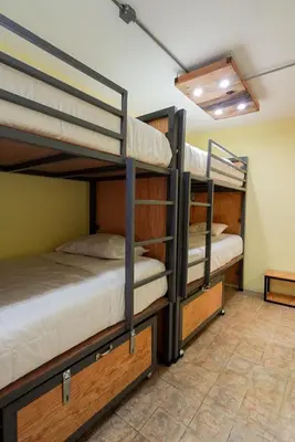 Cama o camas de una habitación en Hostalgia Casa Zul
