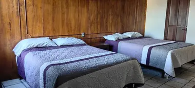 Cama o camas de una habitación en Hotel Avenida