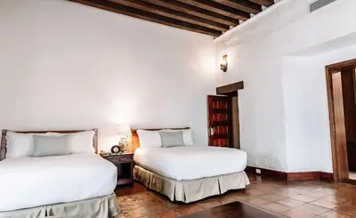 Cama o camas de una habitación en Quinta Real Oaxaca