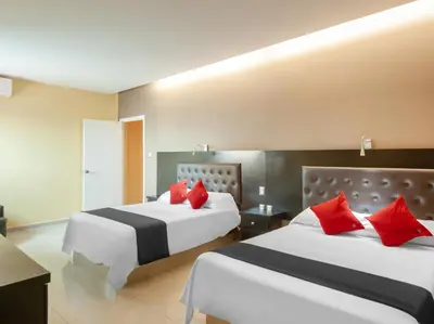 Cama o camas de una habitación en Veracruz Suites Hotel