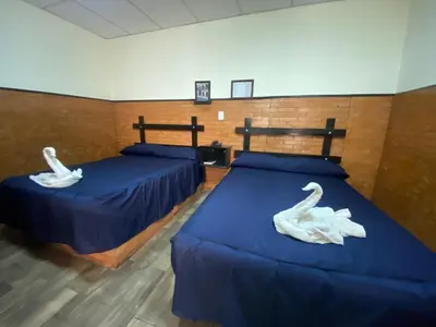 Cama o camas de una habitación en Hotel San Agustin