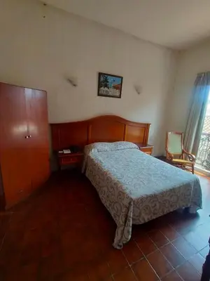 Cama o camas de una habitación en Hotel Posada Doña Lala