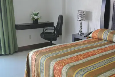 Cama o camas de una habitación en Parque Inn Hotel & Suites