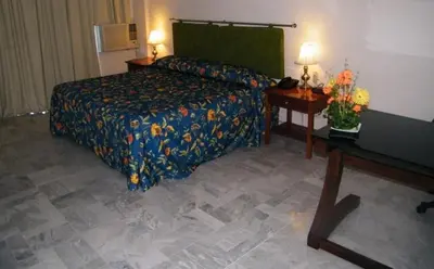 Cama o camas de una habitación en Parque Inn Hotel & Suites