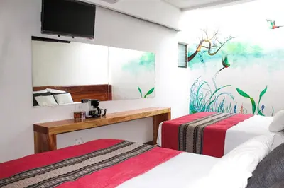 Una televisión o centro de entretenimiento en Axkan Arte Hotel Tuxtla