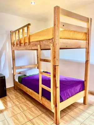 Cama o camas de una habitación en Hostal Amate Taxco