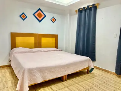 Cama o camas de una habitación en Hostal Amate Taxco