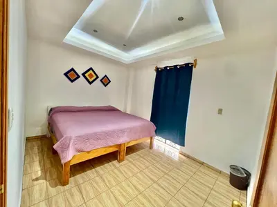 Cama o camas de una habitación en Hostal Amate Taxco